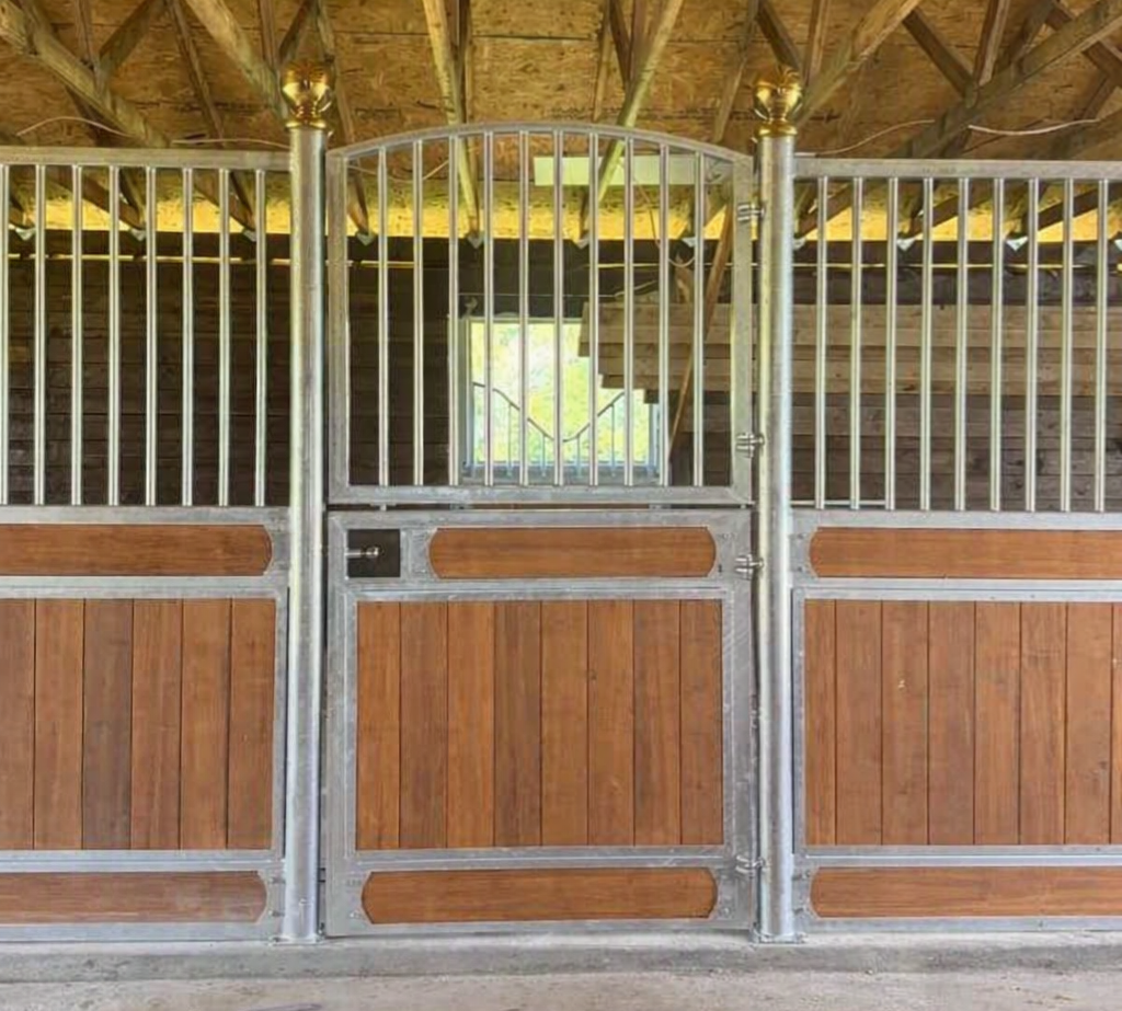 European-style stall front with ornate silver metalwork and warm wood panels